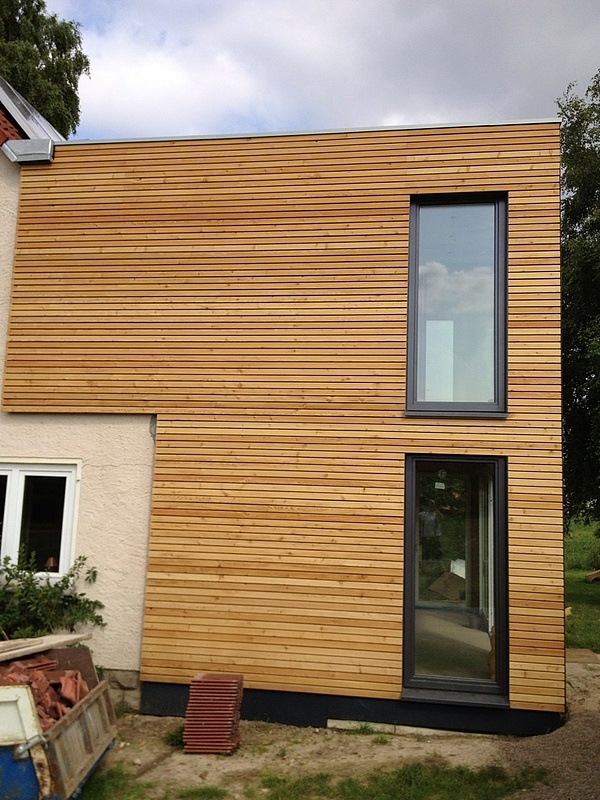 Fassade aus Holz – Moderner Holzbau in Ostwestfalen Lippe - Wohnraumerweiterung mit Holzfassade.