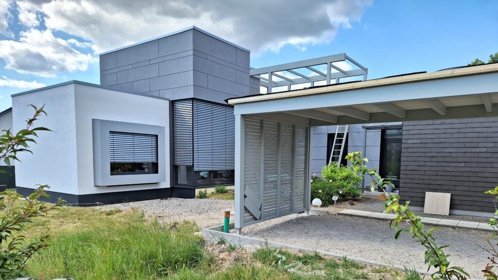 Flachdachanbau in Detmold - Erweitern Sie Ihren Wohnraum durch einen modernen Anbau im Holzrahmenbau.